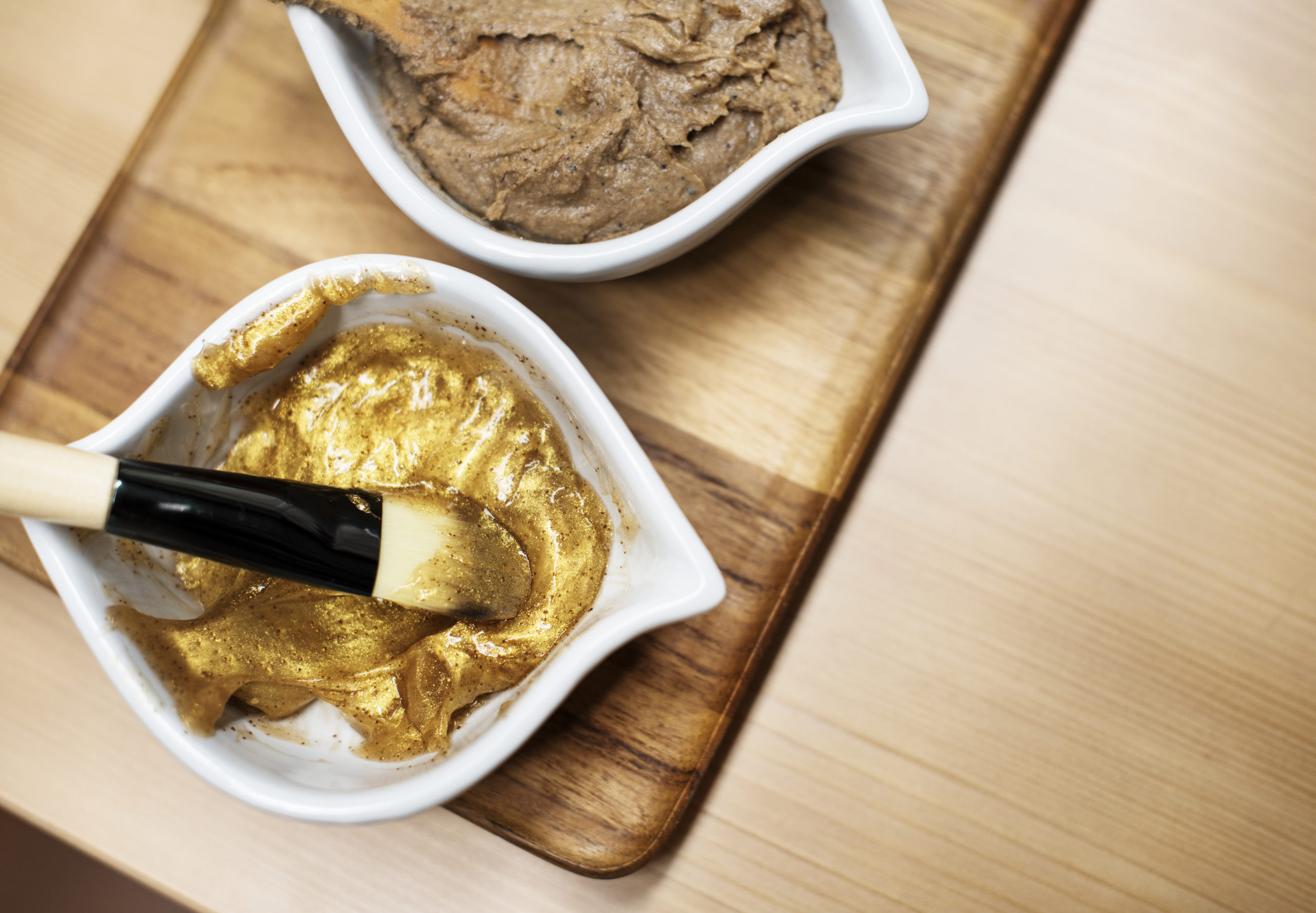 Luxury salon treatments and gold face masks with brush